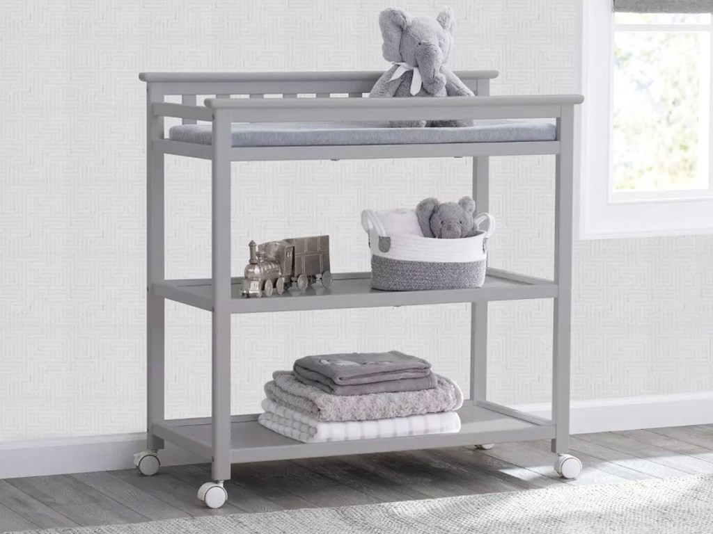 grey changing table in nursery