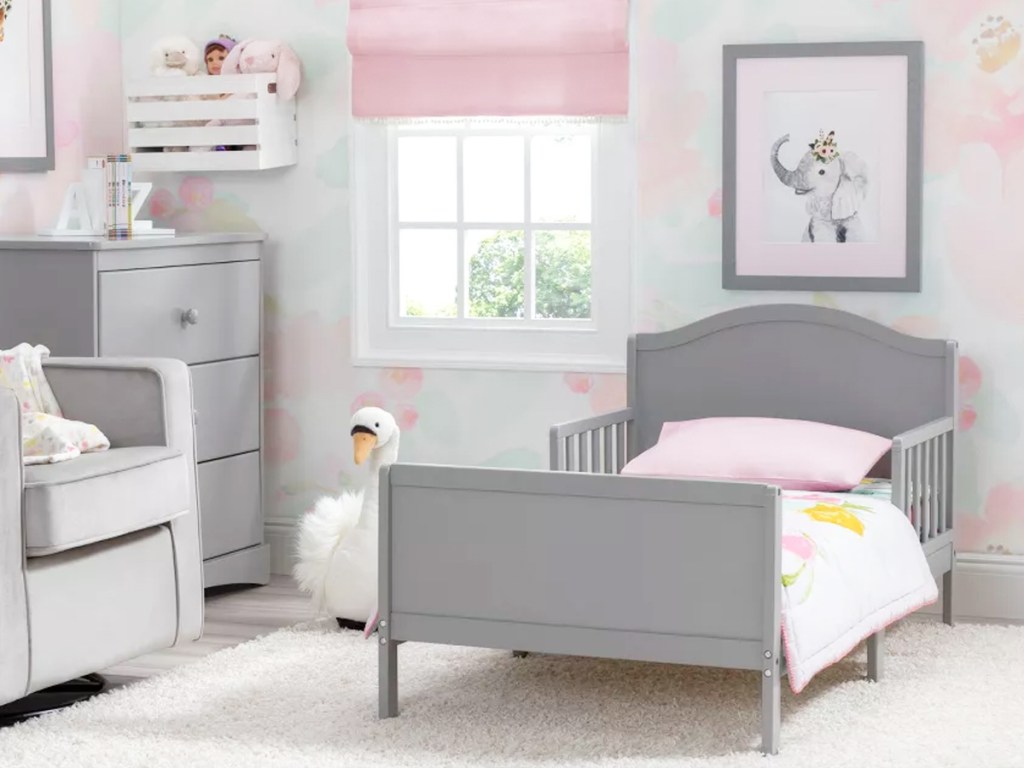 grey toddler bed in girls bedroom