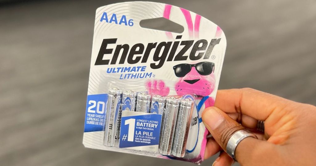 Hand holding a pack of Energizer Ultimate Lithium Batteries