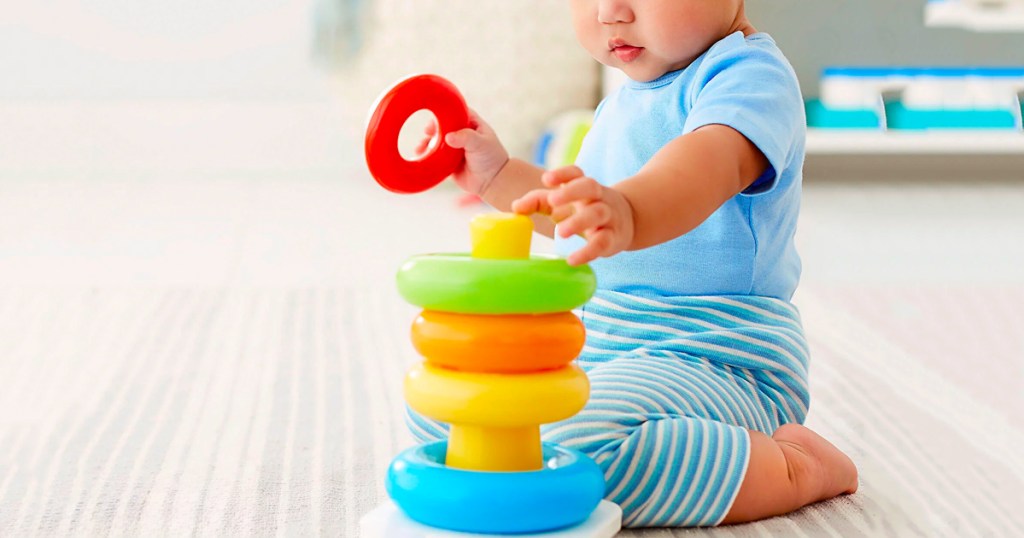 Baby playing with Fisher-Price Rock-a-Stack Ring Stacking Toy