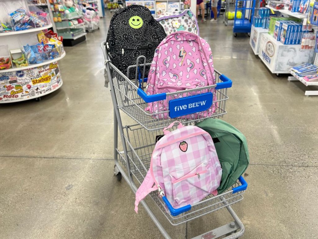 several backpacks in five below cart