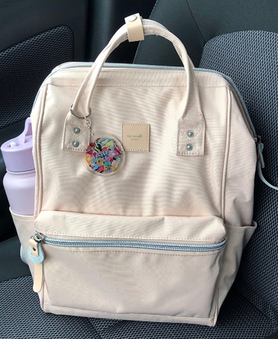 tote bag on car seat with purple water bottle