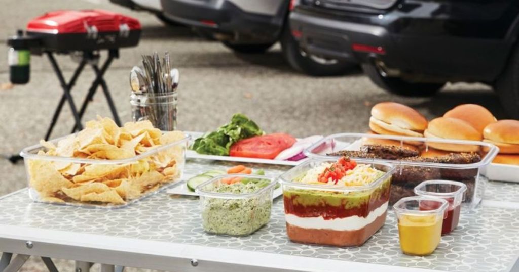 Rubbermaid Brilliance Food Storage 12-Piece Set shown on table at a tailgating event