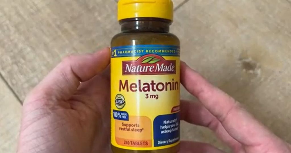 Nature Made Melatonin 3mg Tablets 240-Count shown in man's hands on table