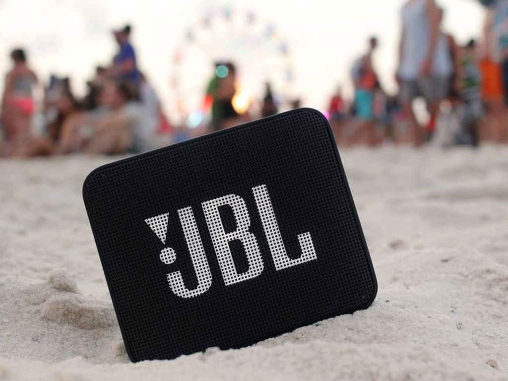 BL GO 2 Portable Bluetooth Speaker shown in the sand at a beach party
