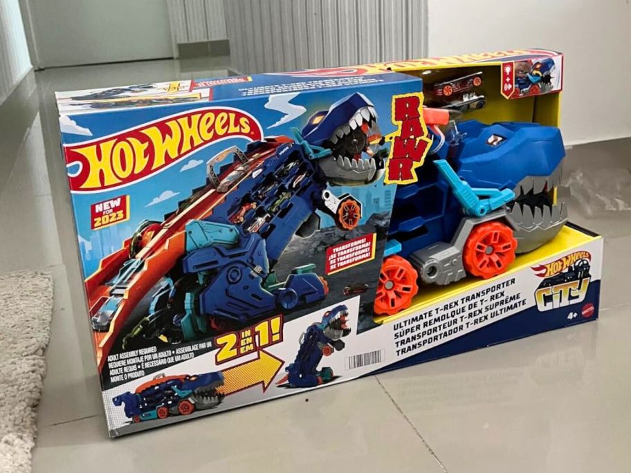 Hot Wheels T-Rex Hauler Set new in the box on a floor
