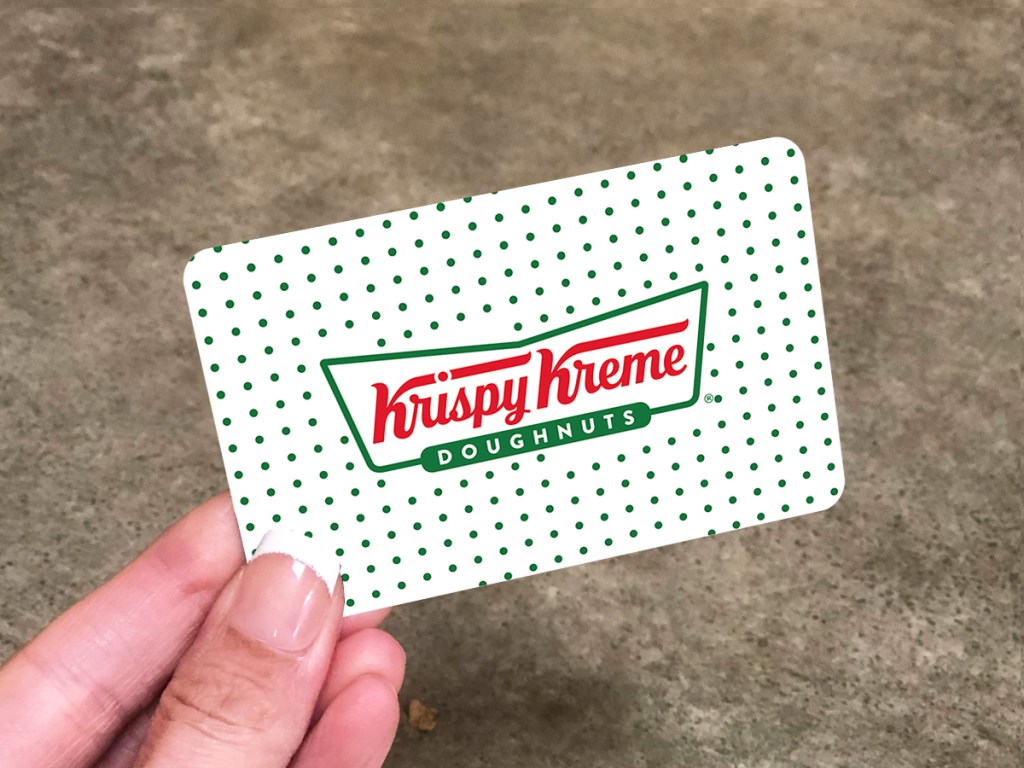 hand holding a krispy kreme gift card