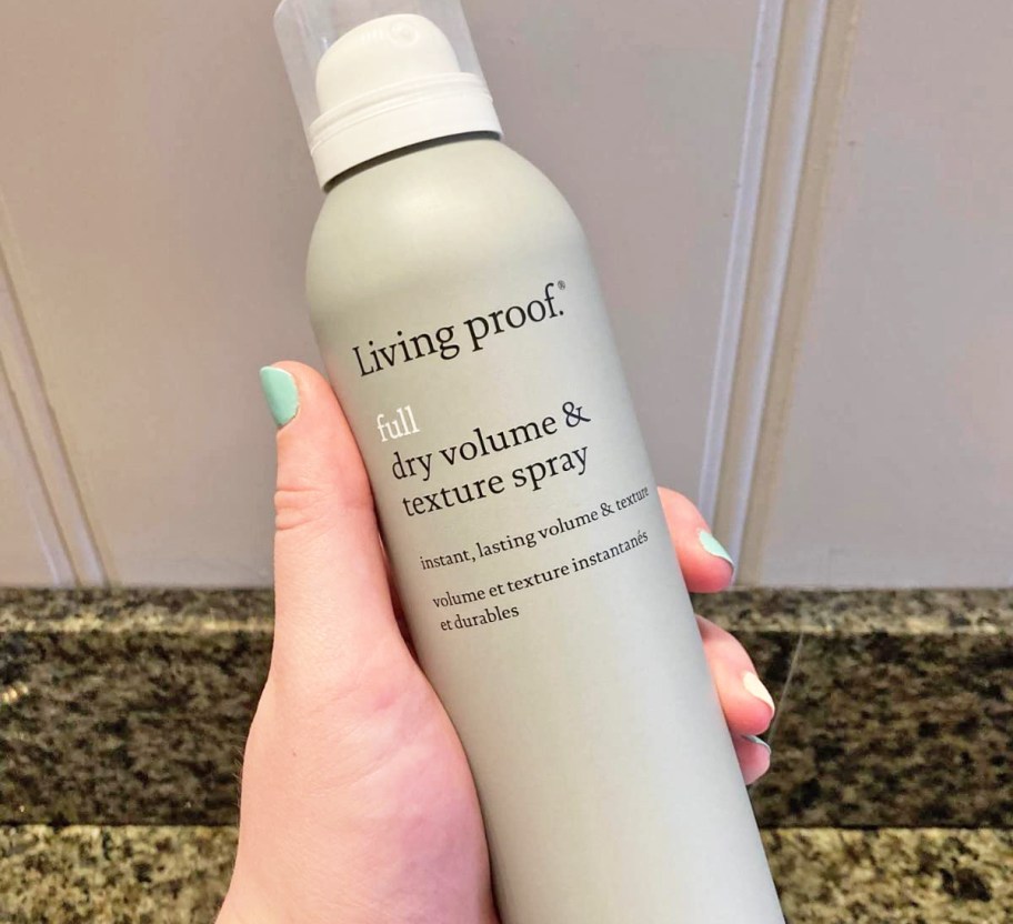 hand holding a bottle of Living Proof Full Dry Volume & Texture Spray