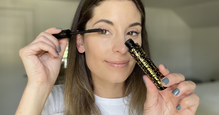 woman applying mascara