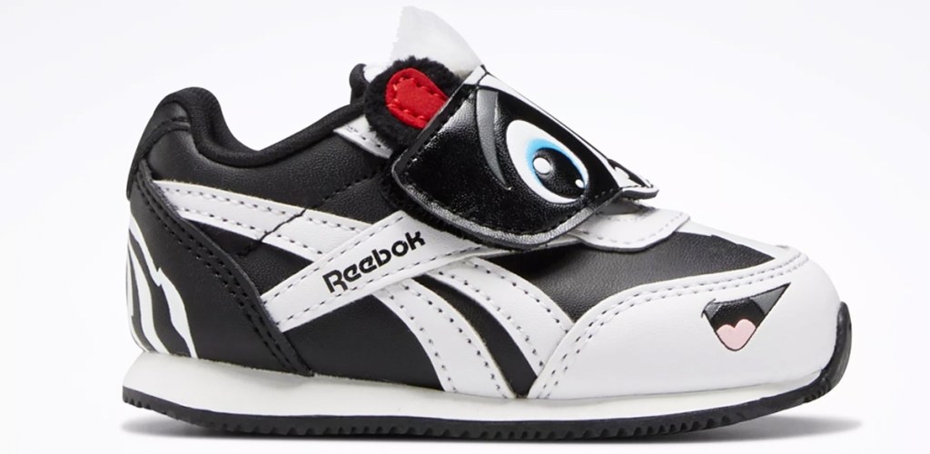 black and white reebok todler shoe with face on it