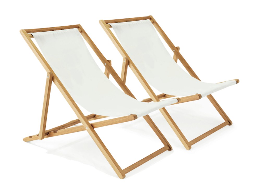 stock photos of two wood and white sling beach chairs on white background