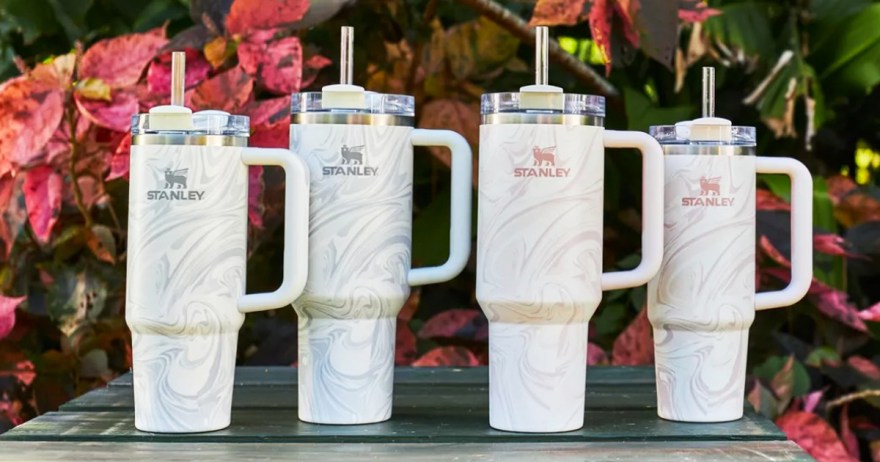 four stanley tumblers with a swirl print