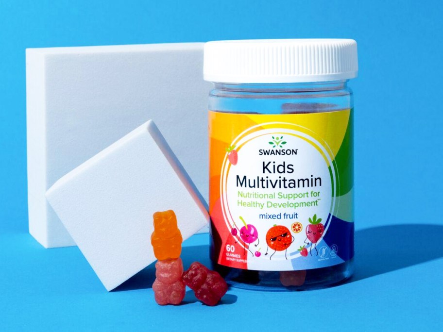 bottle of Swanson Premium Kids Multivitamin Gummies with blue background