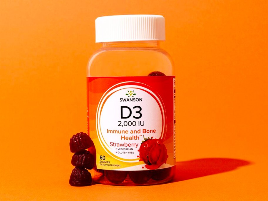 bottle of Swanson Premium Vitamin D3 Gummies with orange background