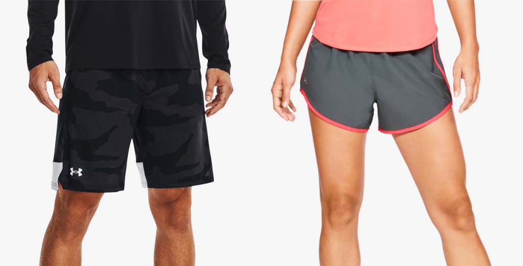 man in black shorts and woman in grey and pink shorts