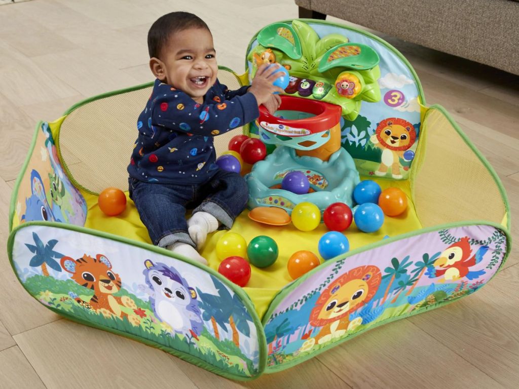 A child playing in a ball pit