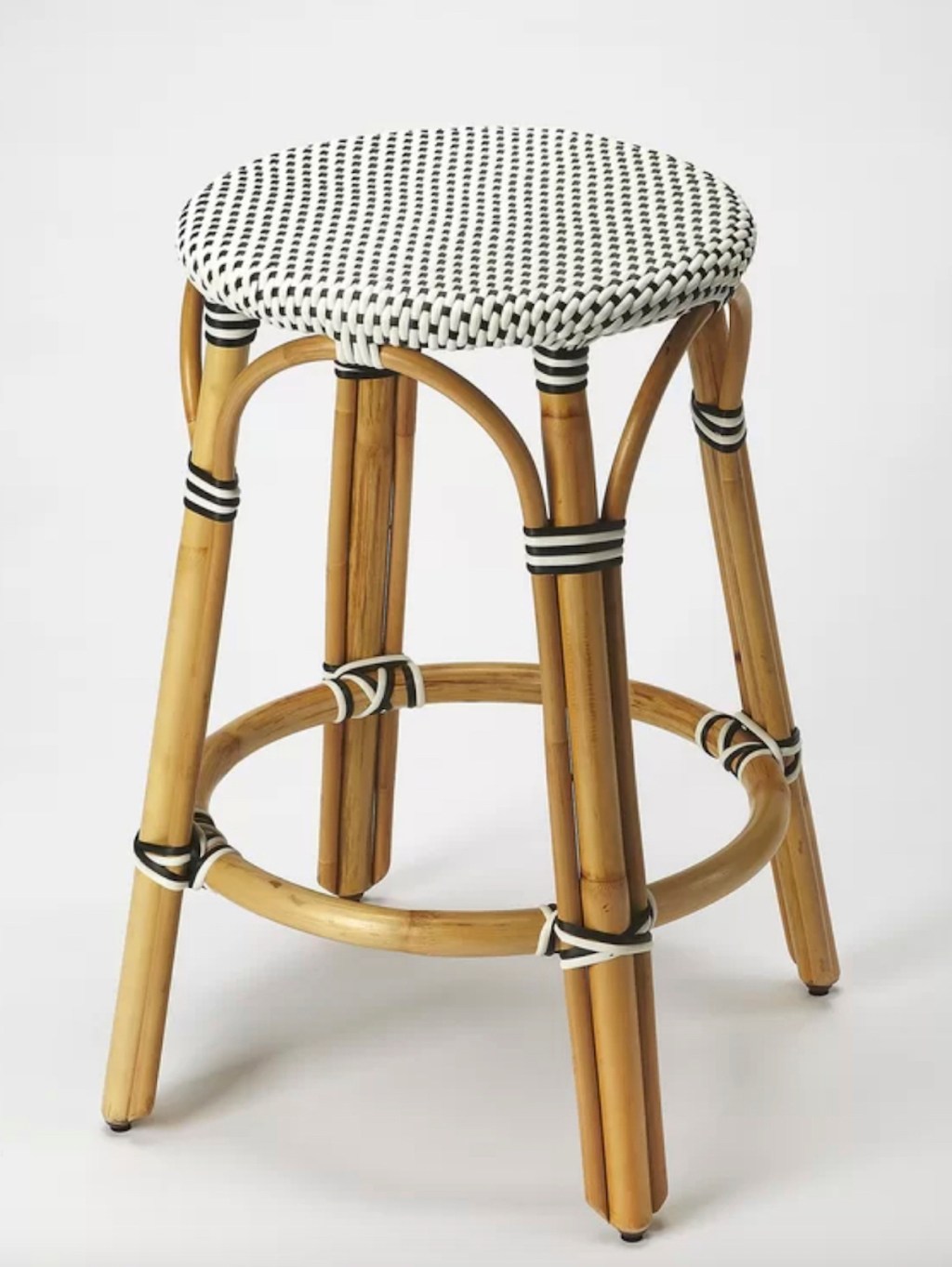 stock photo of wicker barstool on gray background