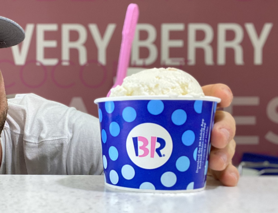 hand holding cup of baskin robbins ice cream