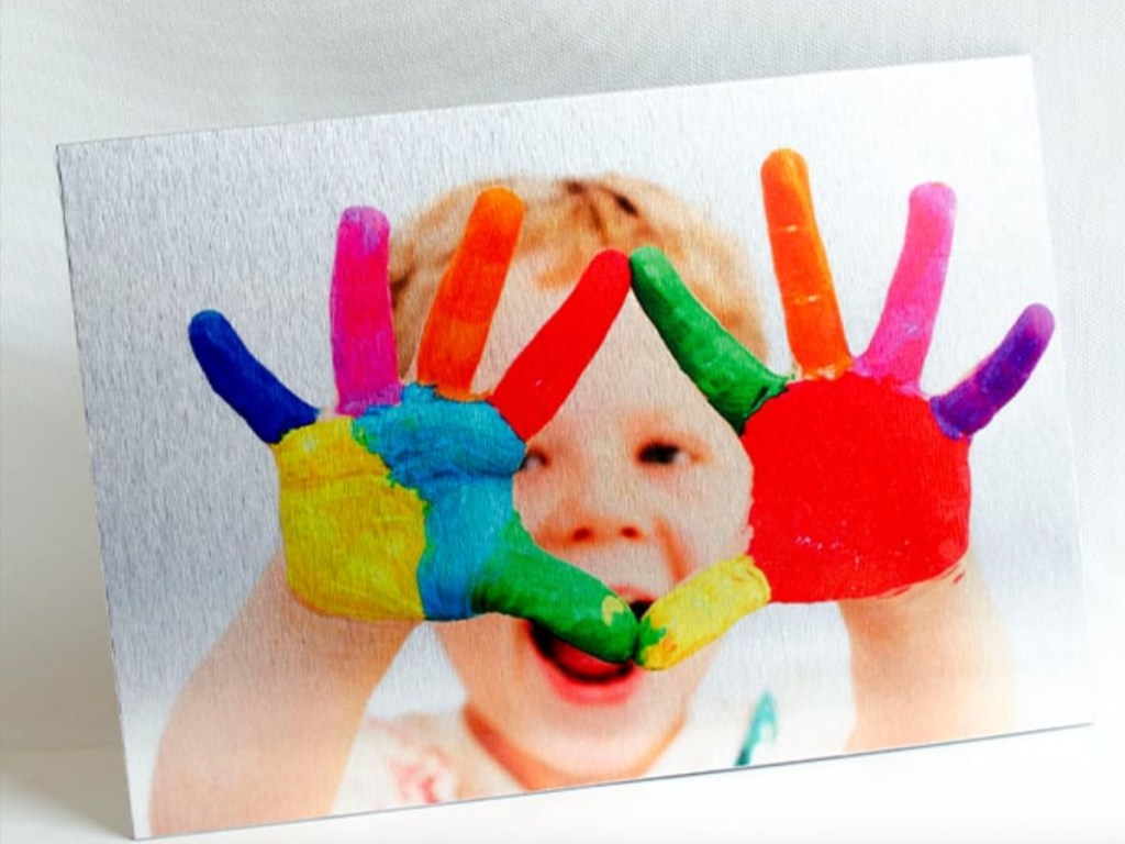 metal print of boy with painted fingers