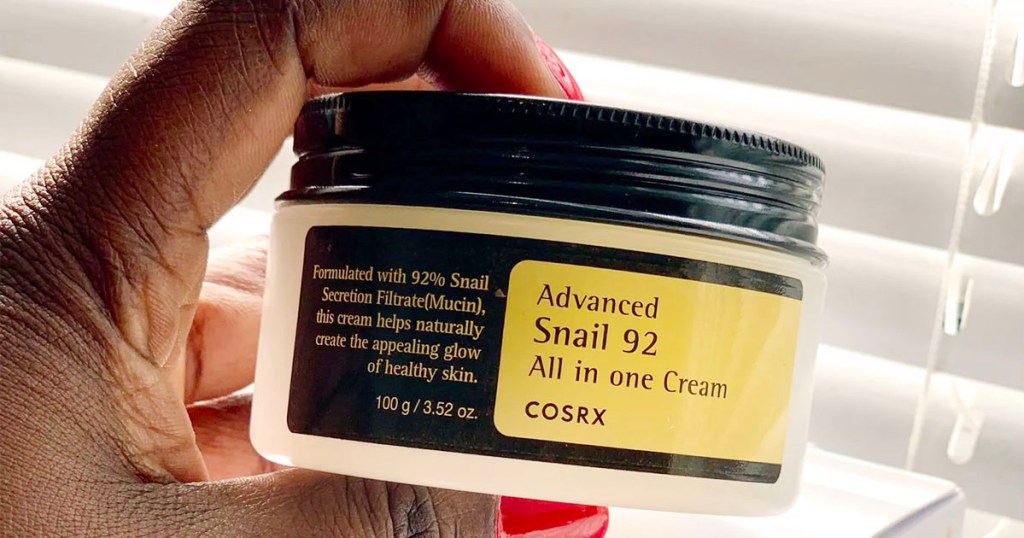 hand holding cosrx snail 92 advanced cream