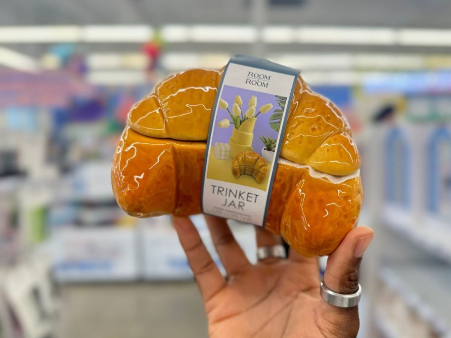 Croissant Trinket Jar being held by hand in store