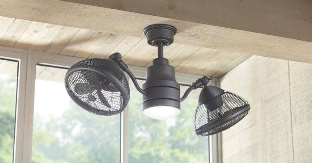 black ceiling fan with light hanging from wood ceiling