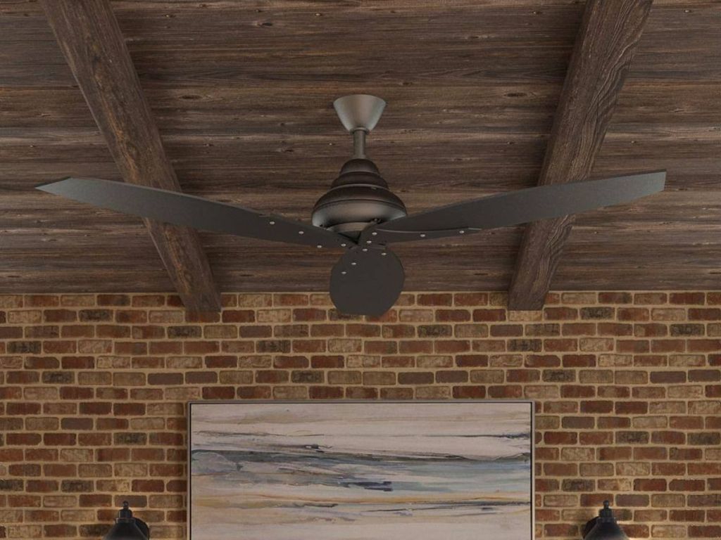 black ceiling fan hanging on wood ceiling