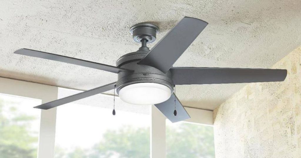 gray ceiling fan with light hanging from white ceiling