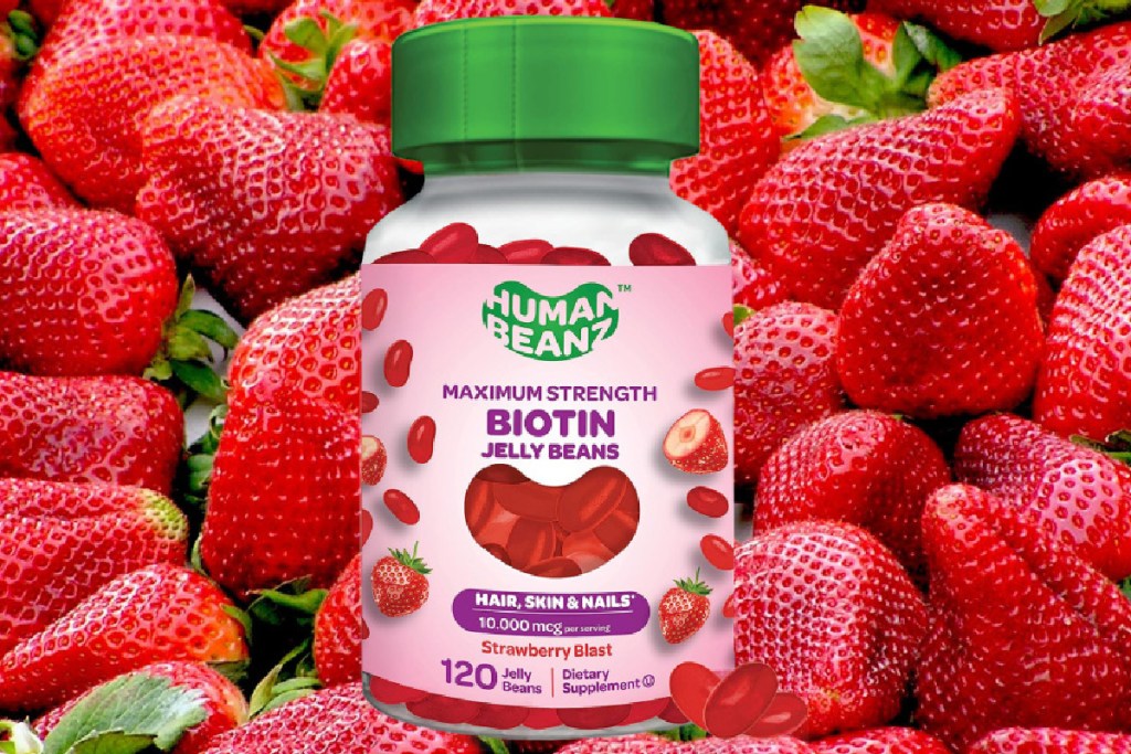 vitamin bottle in pile of strawberries