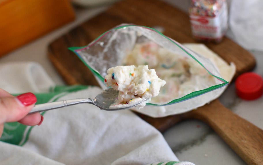 spoon with vanilla ice cream with bag of ice cream 