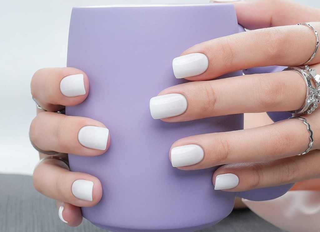 jofay nails in white holding cup