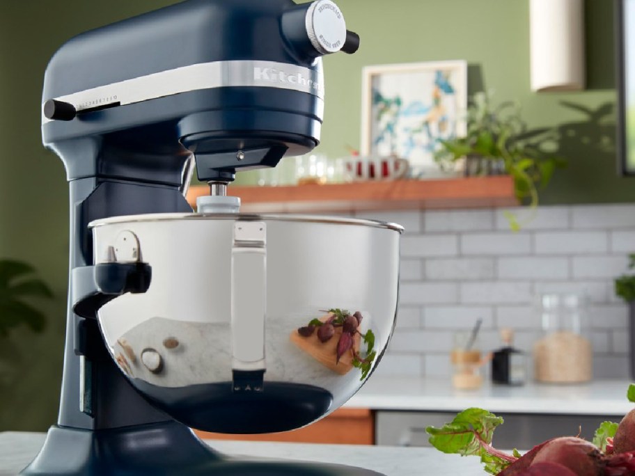 kitchenaid mixer in navy with steel bowl on counter