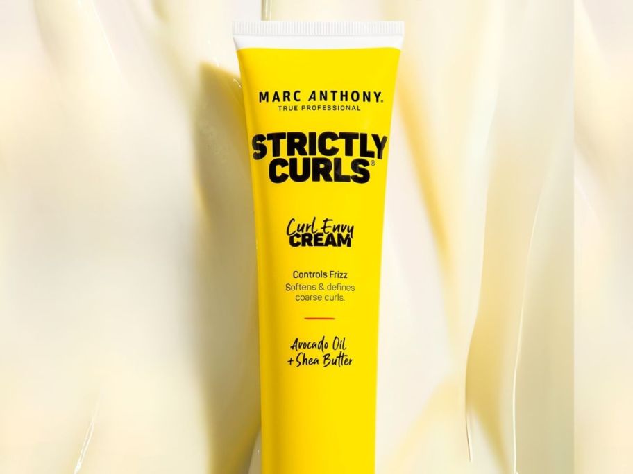 Marc Anthony Curl Envy Cream tube on yellow background