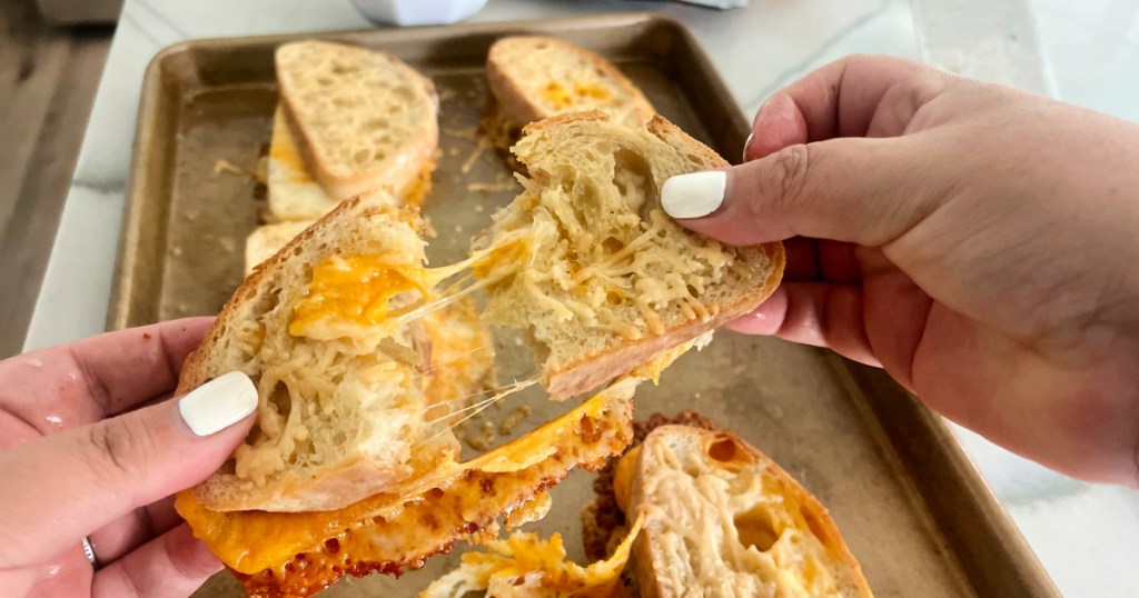 pulling apart a grilled cheese sandwich