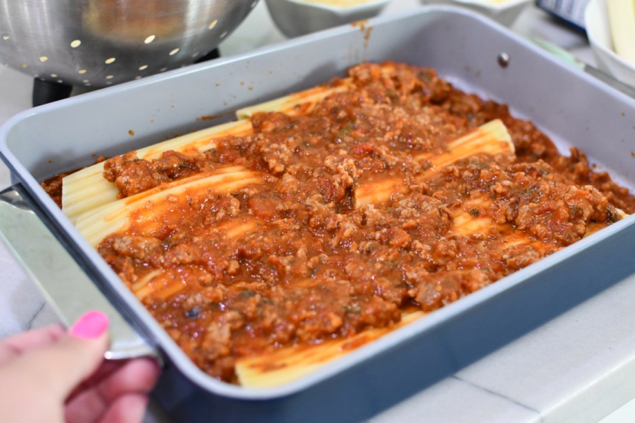 stuffed manicotti with pasta sauce on top