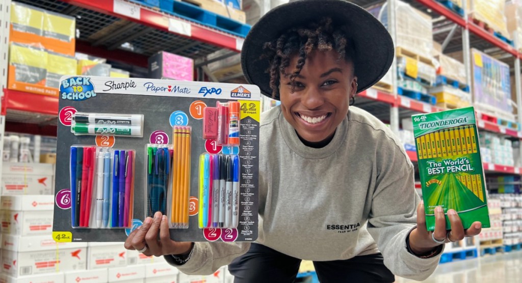 woman holding kids supplies from sams club at the store