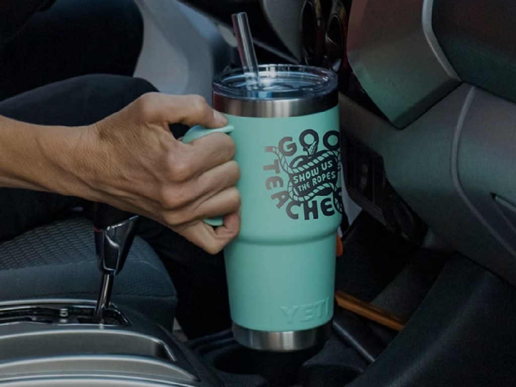 woman holding a yeti custom tumbler