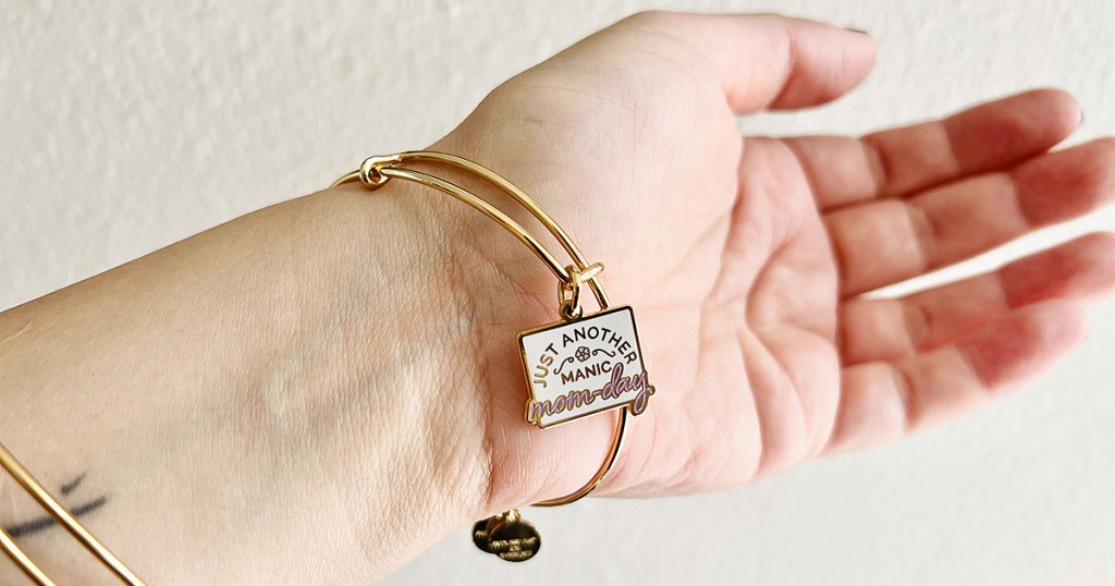 arm with charm bracelet that says Just Another Manic Mom-Day