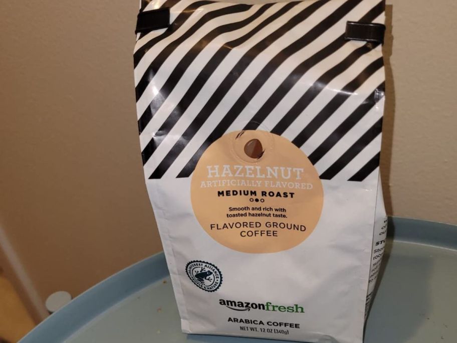AmazonFresh Hazelnut Flavored Ground Coffee 12oz Bag on table