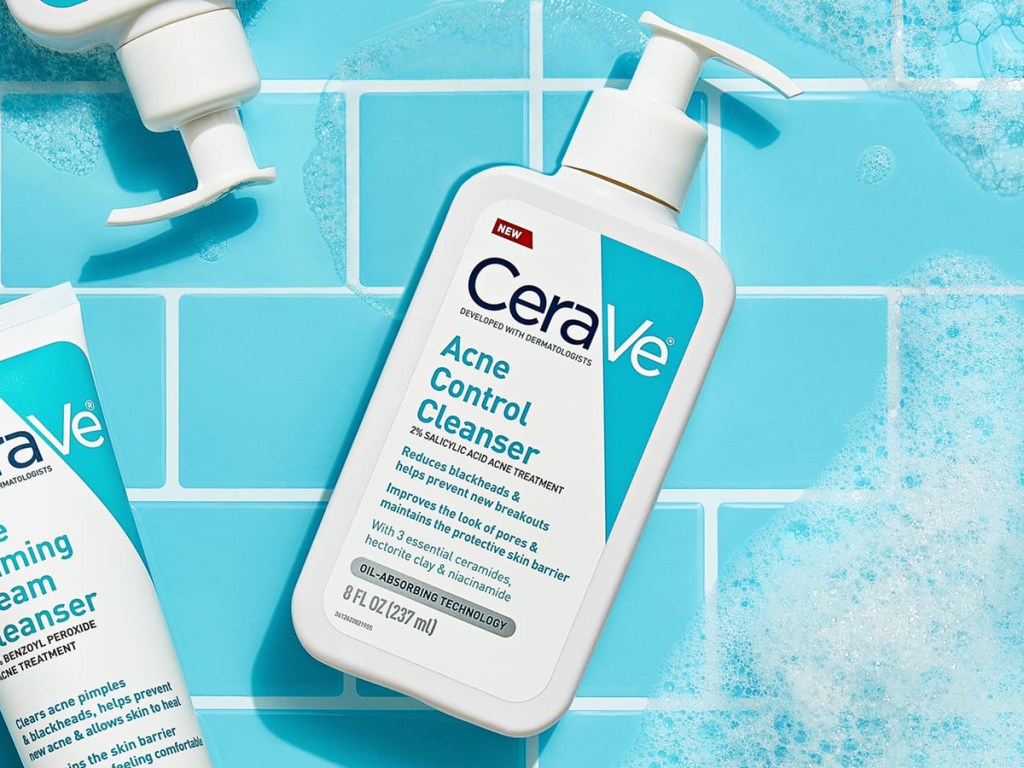 CeraVe Acne Control Facial Cleanser bottle on blue tiles