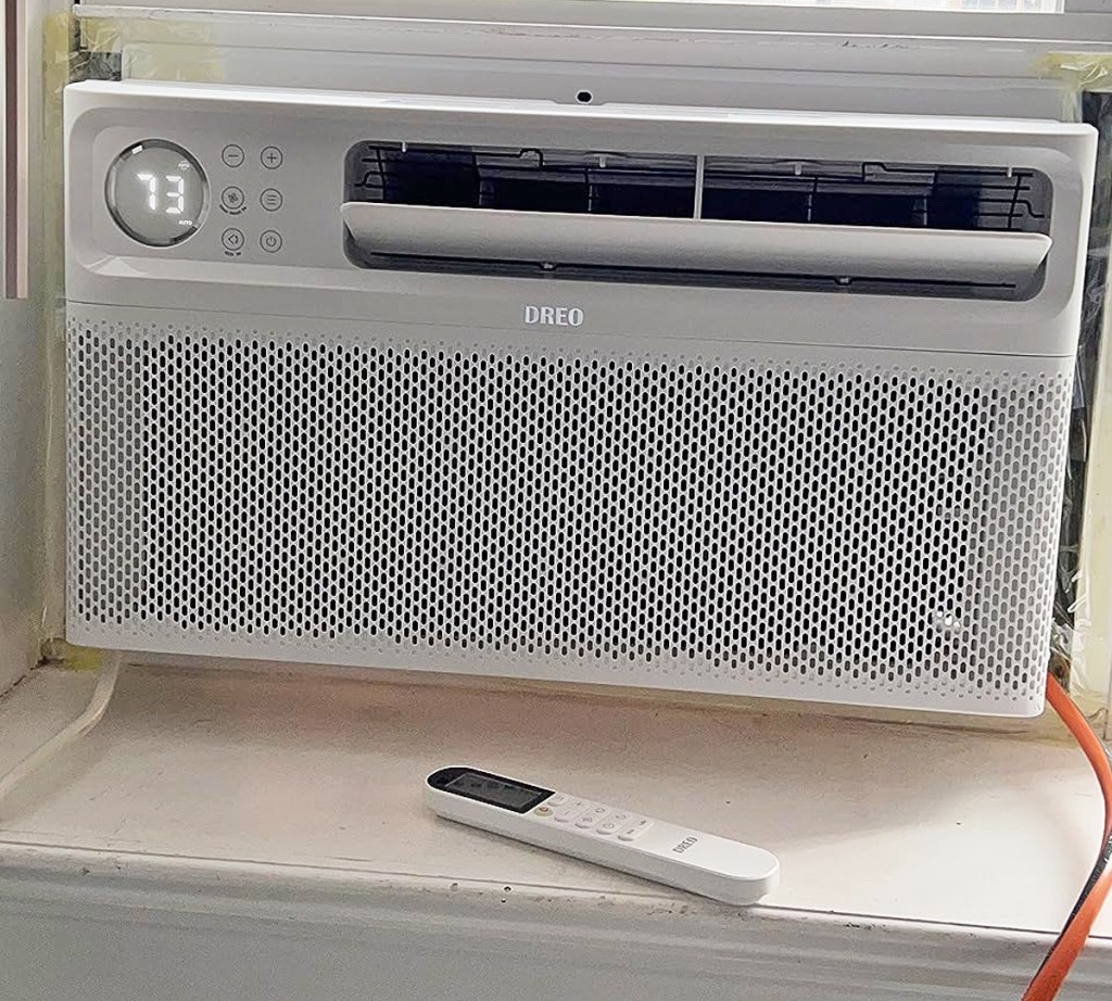 white a/c unit with remote control