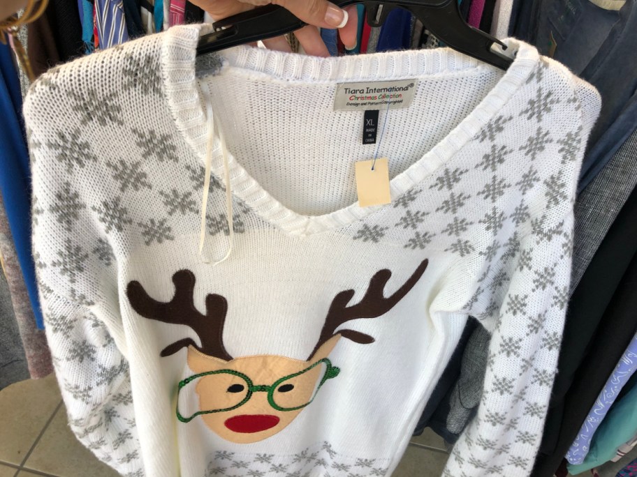 A goodwill Christmas sweater with rudolph on it