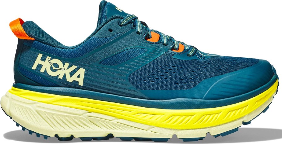 blue and yellow hoka running shoe