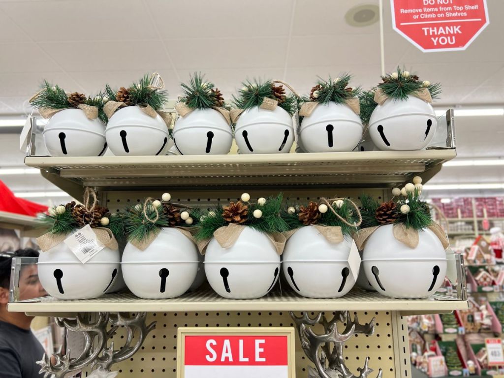 Medium and Large Size White Jingle Bells with winter decor at Hobby Lobby