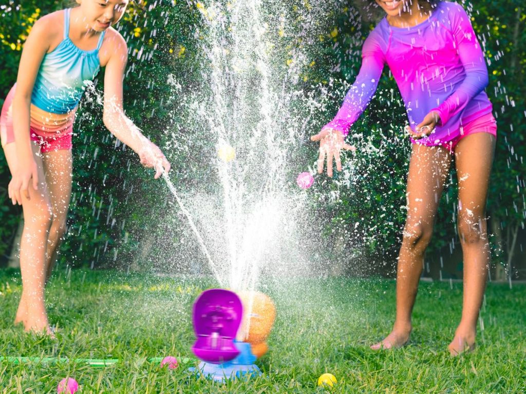 Two girls playing in a sprinkler Hungry Hungry Hippos Splash