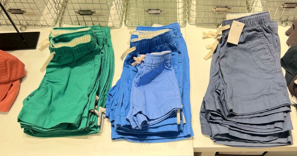 green blue and dark blue drawstring shorts on display in store
