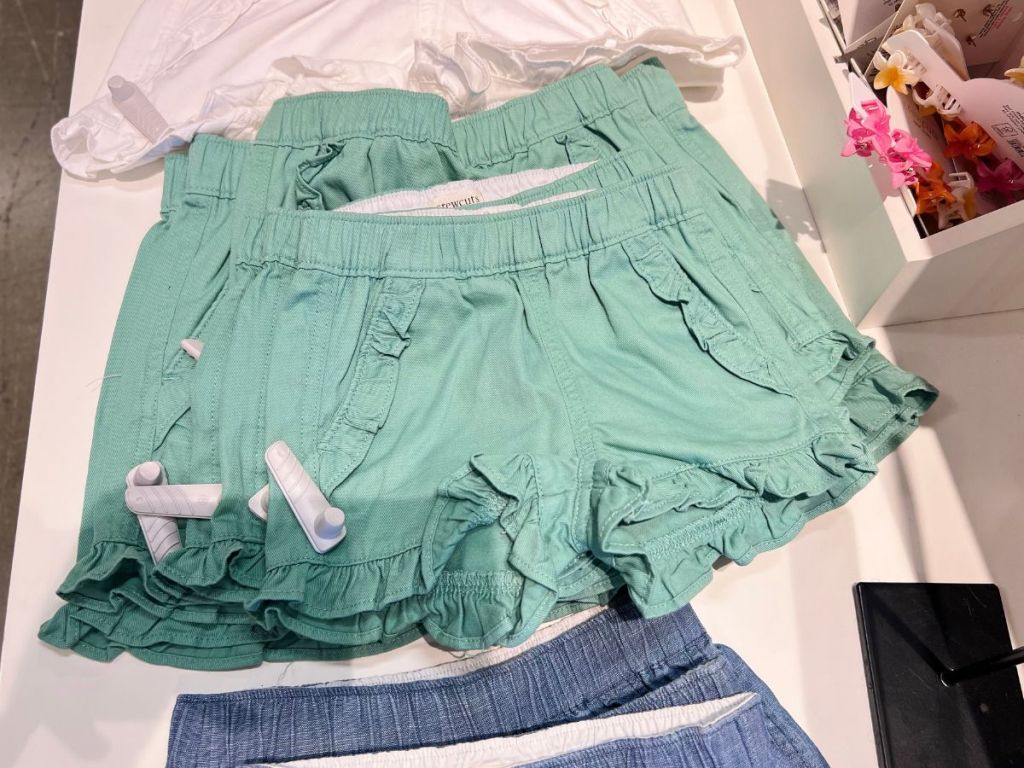 green girls ruffle shorts on display in store