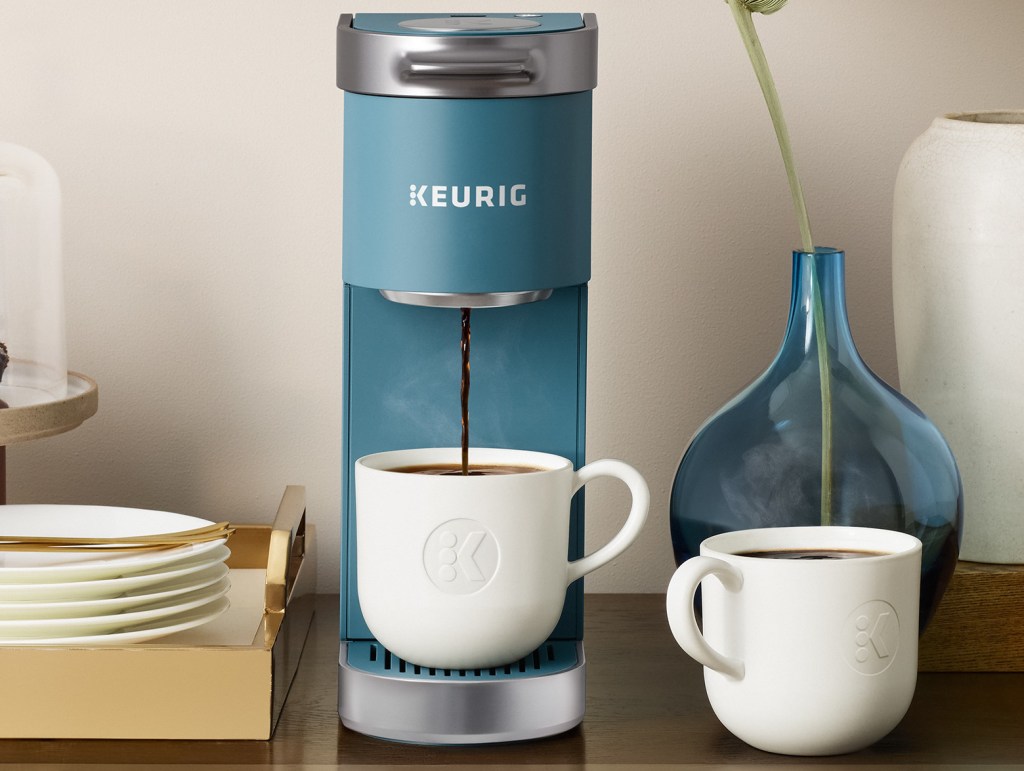 Keurig coffee maker dispensing coffee into a white mug