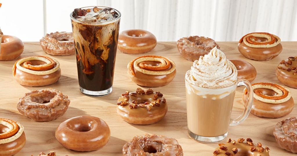 A table with doughnuts and coffee drinks from Krispy Kreme's Pumpkin Spice collection