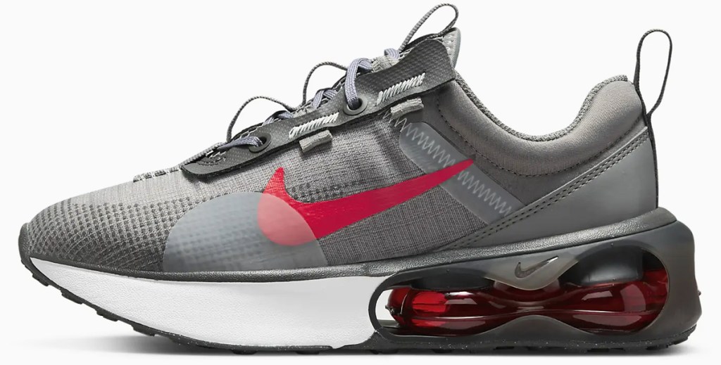 grey and red nike shoe